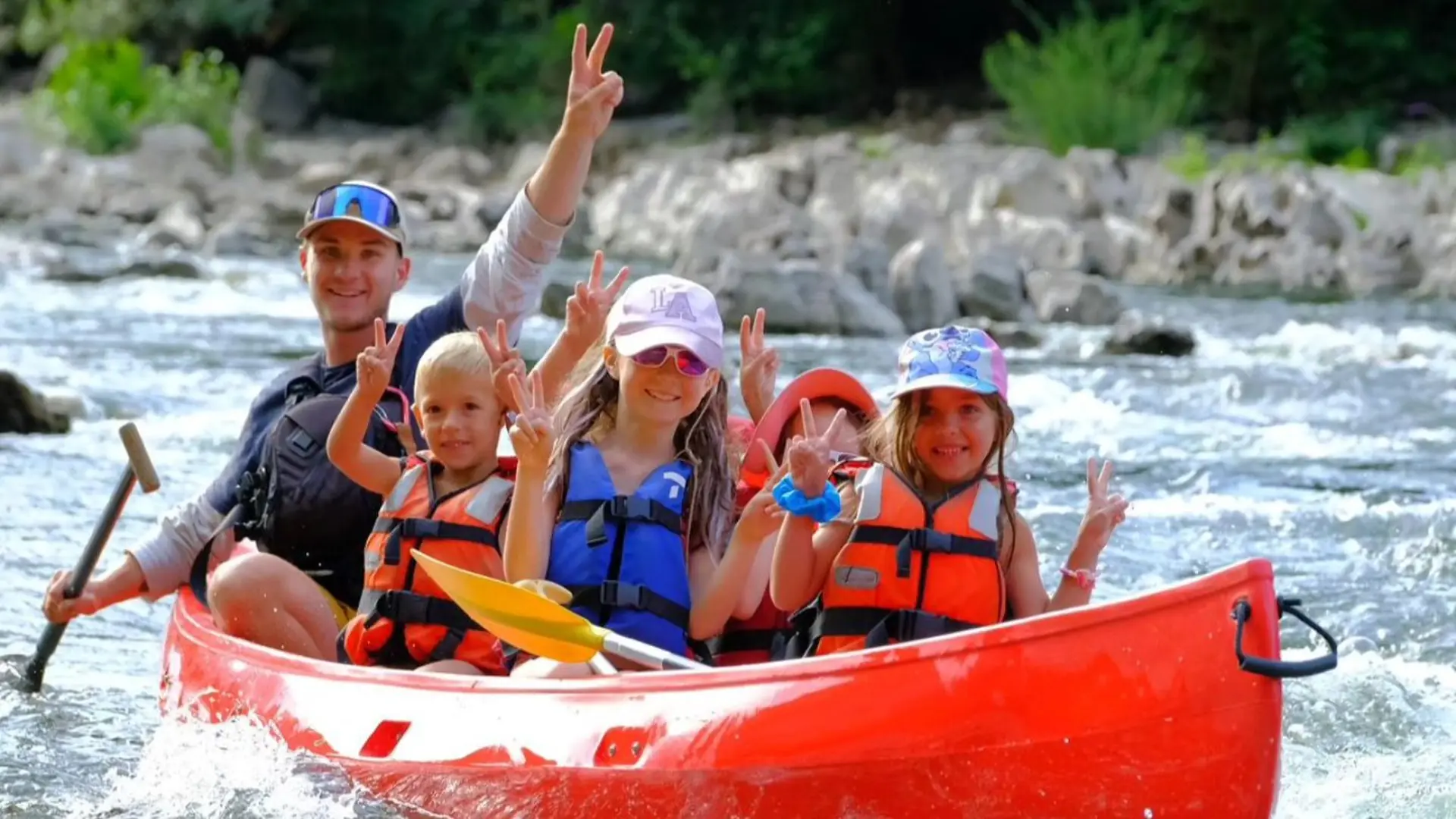 A family canoeing on the Ardèche in June